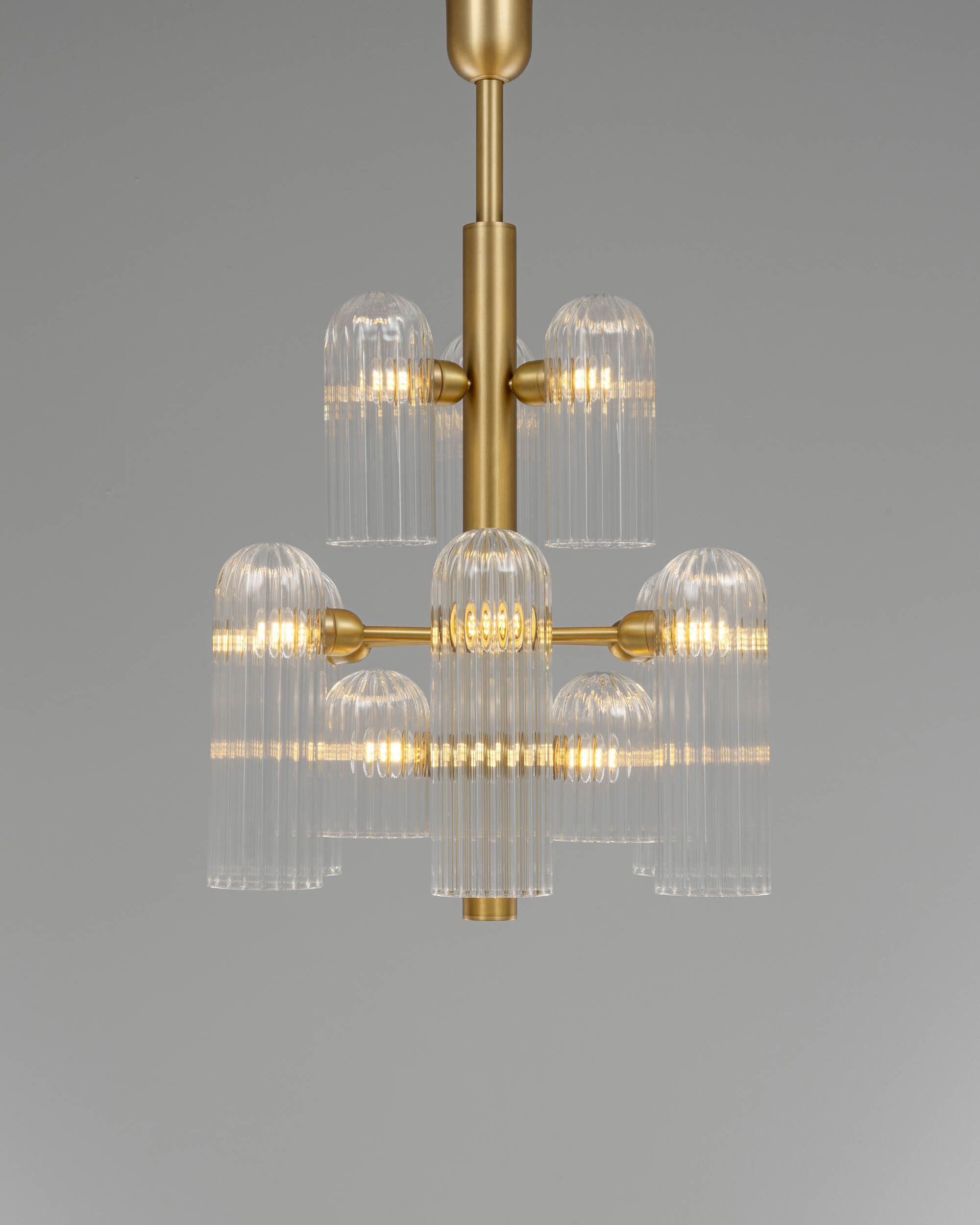 Odyssey 12 brass and glass Chandelier in lacqured burnished brass finish handcrafted by Schwung