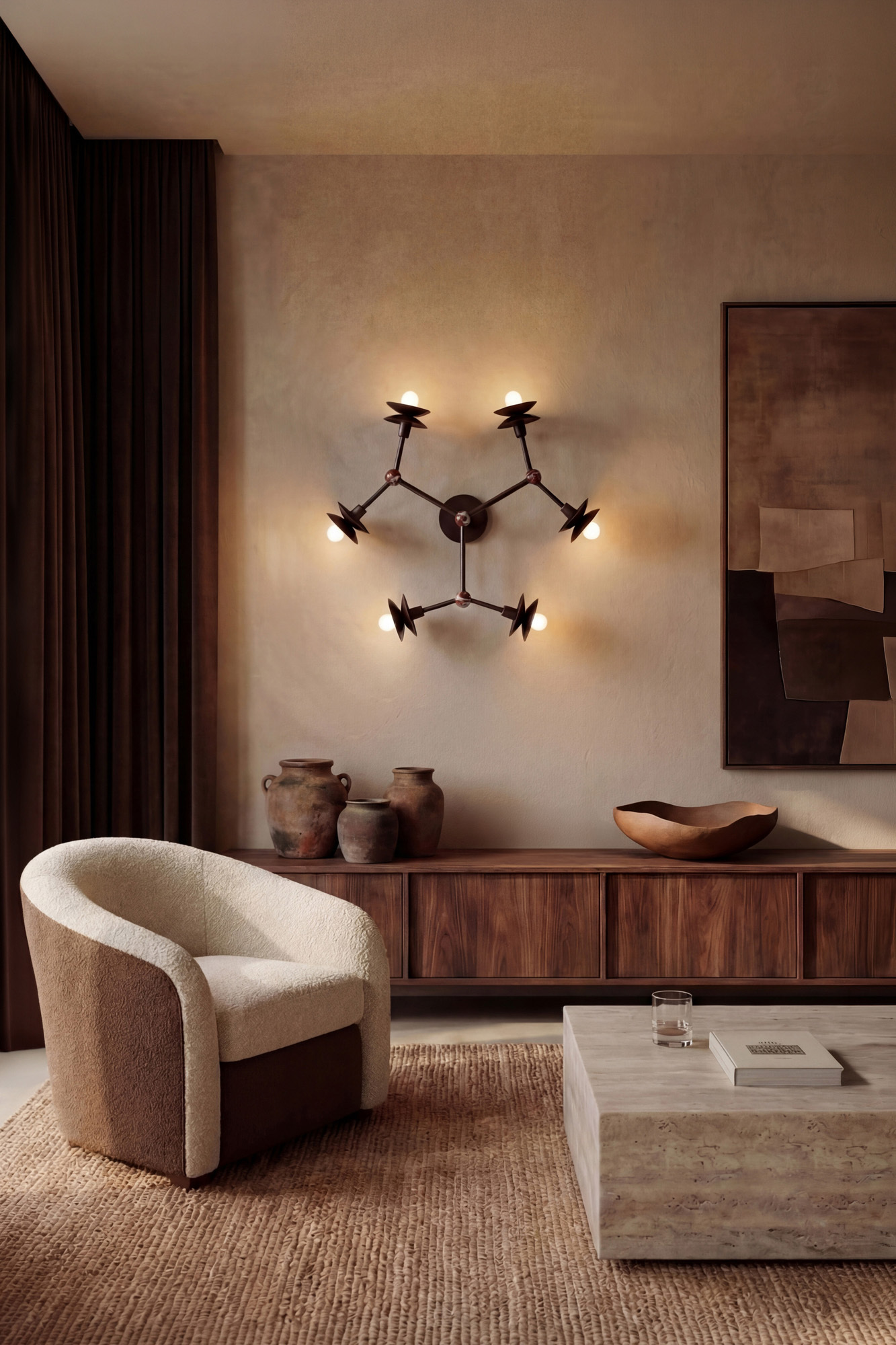 Babylon 6 brass and marble wall sconce/flush mount in a Classic Bronze finish, handcrafted by Schwung, installed on a living room wall above a sideboard.