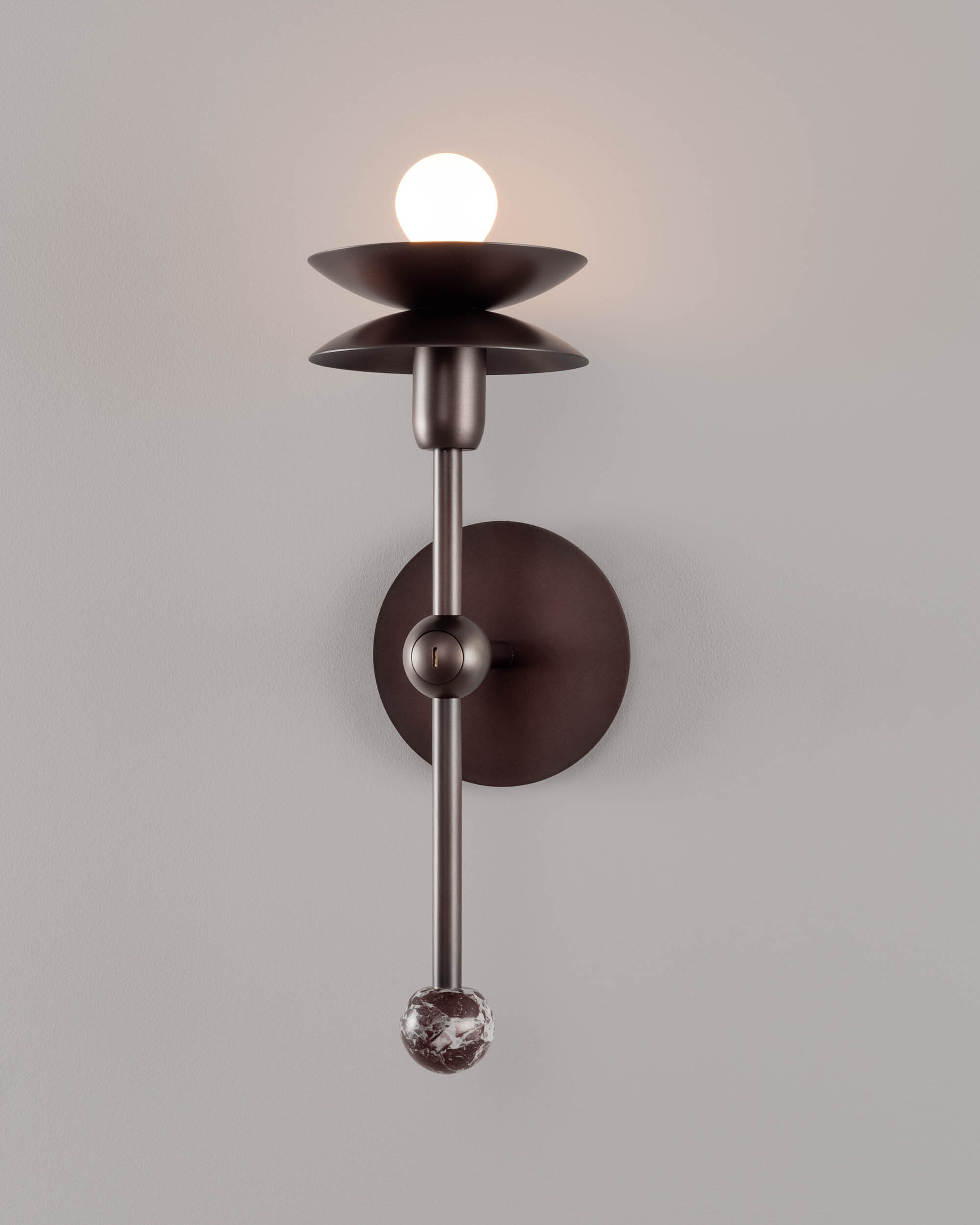 Babylon Single brass and marble Wall Sconce in classic bronze finish handcrafted by Schwung