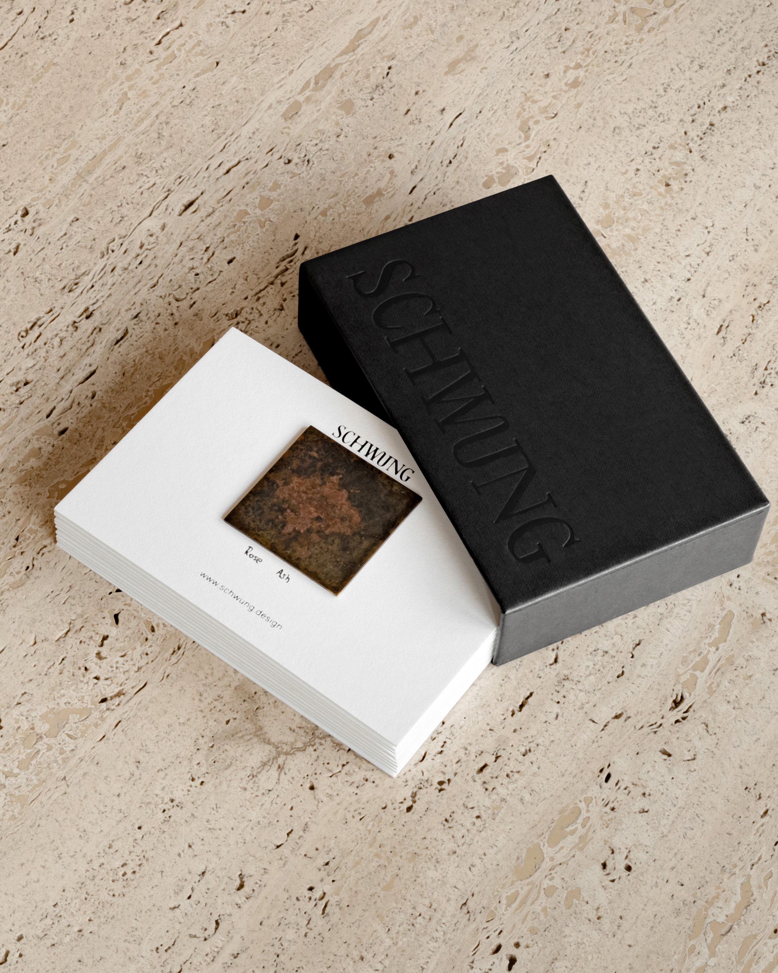 Small Schwung brass finish sample box with 5 × 5 cm finish cards.