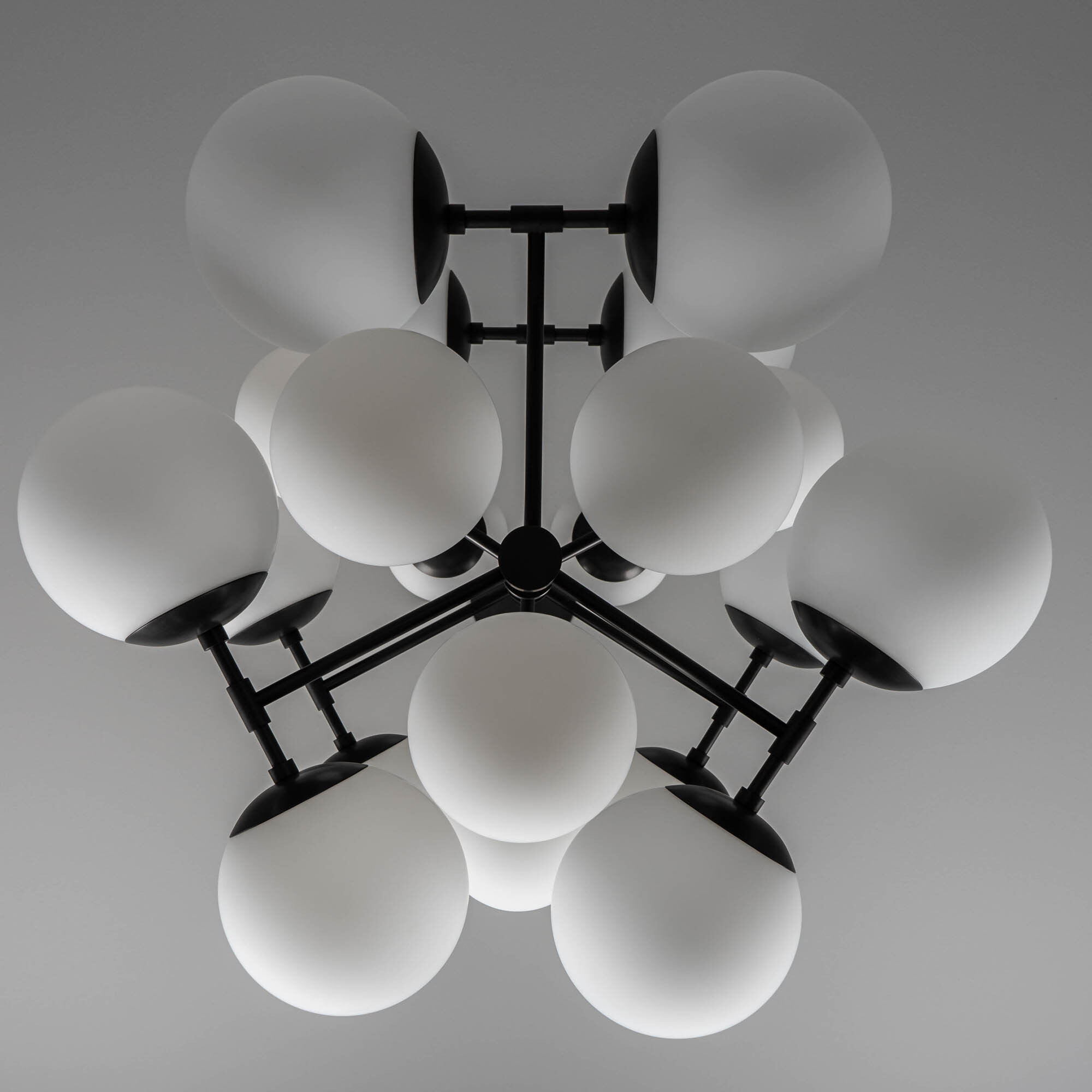 Glow brass and glass Chandelier in Black Gunmetal handcrafted by Schwung