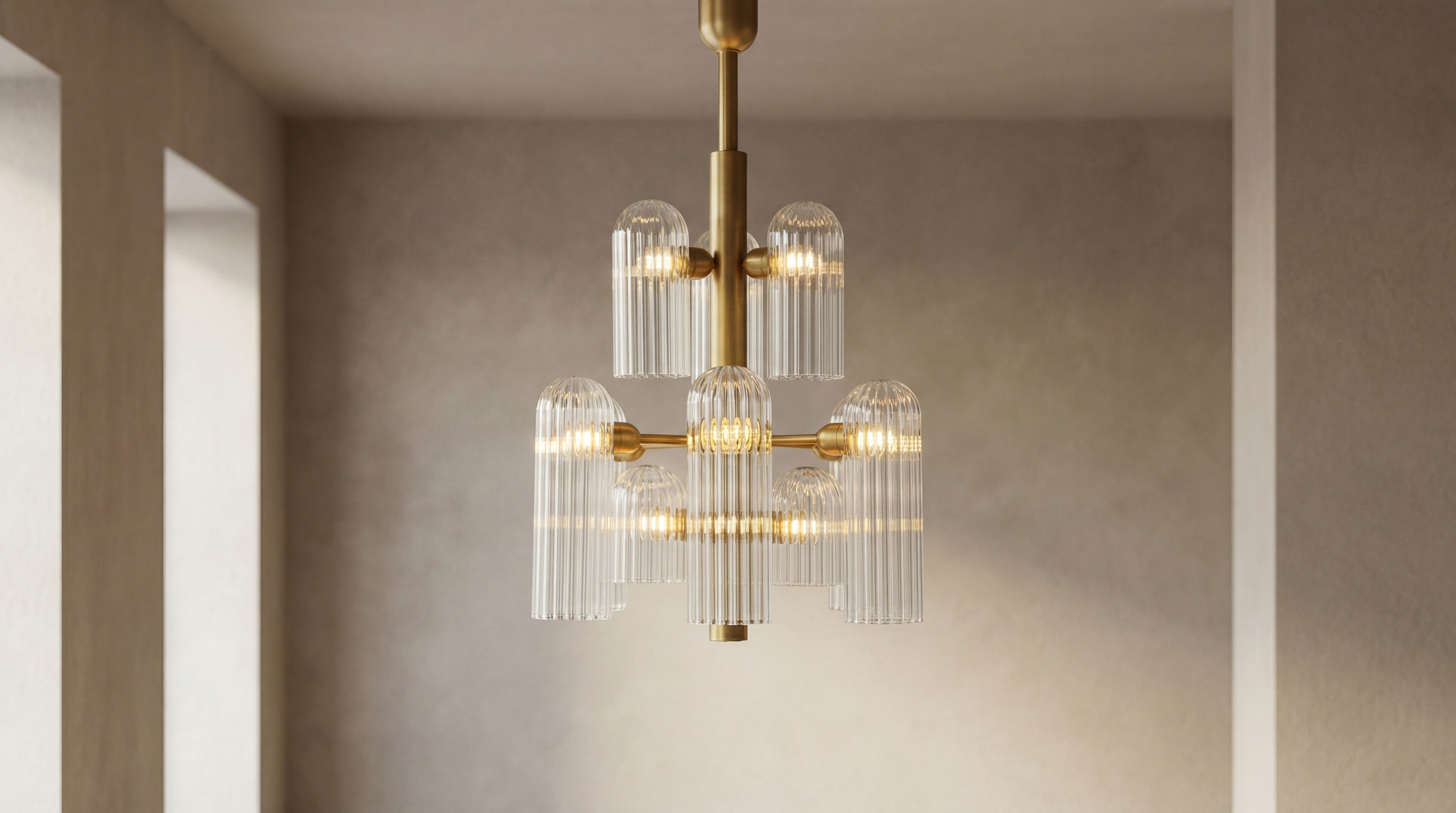 Odyssey 12 brass and glass Chandelier in lacqured burnished brass finish handcrafted by Schwung