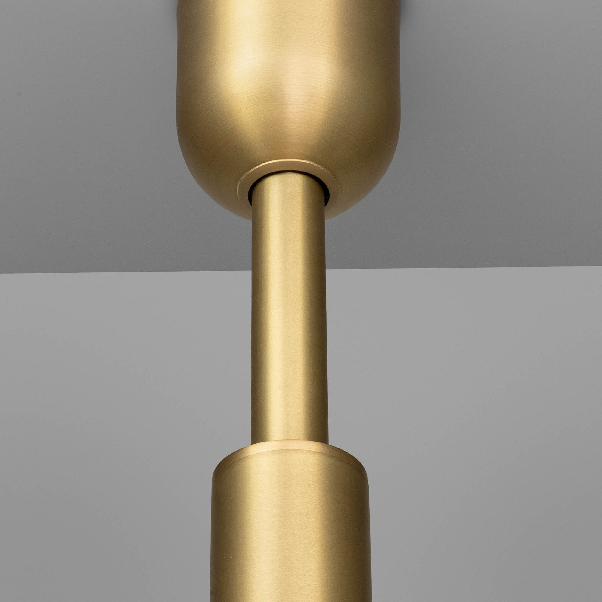 Close-up of brass canopy in Odyssey12 showcasing the handcrafted lighting detail by Schwung.