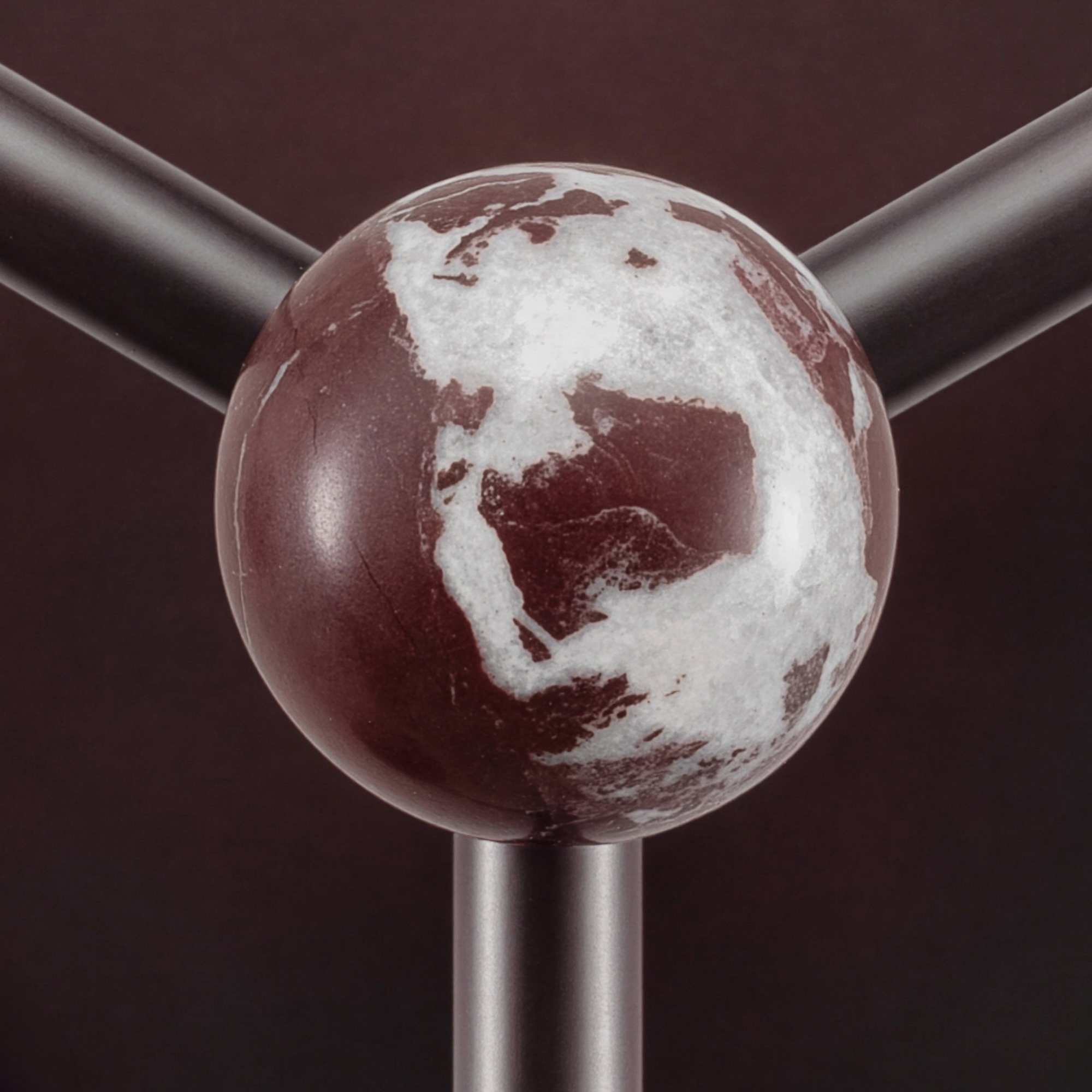 Close-up detail of the Babylon 6 chandelier, handcrafted by Schwung in brass and marble with a Classic Bronze finish.