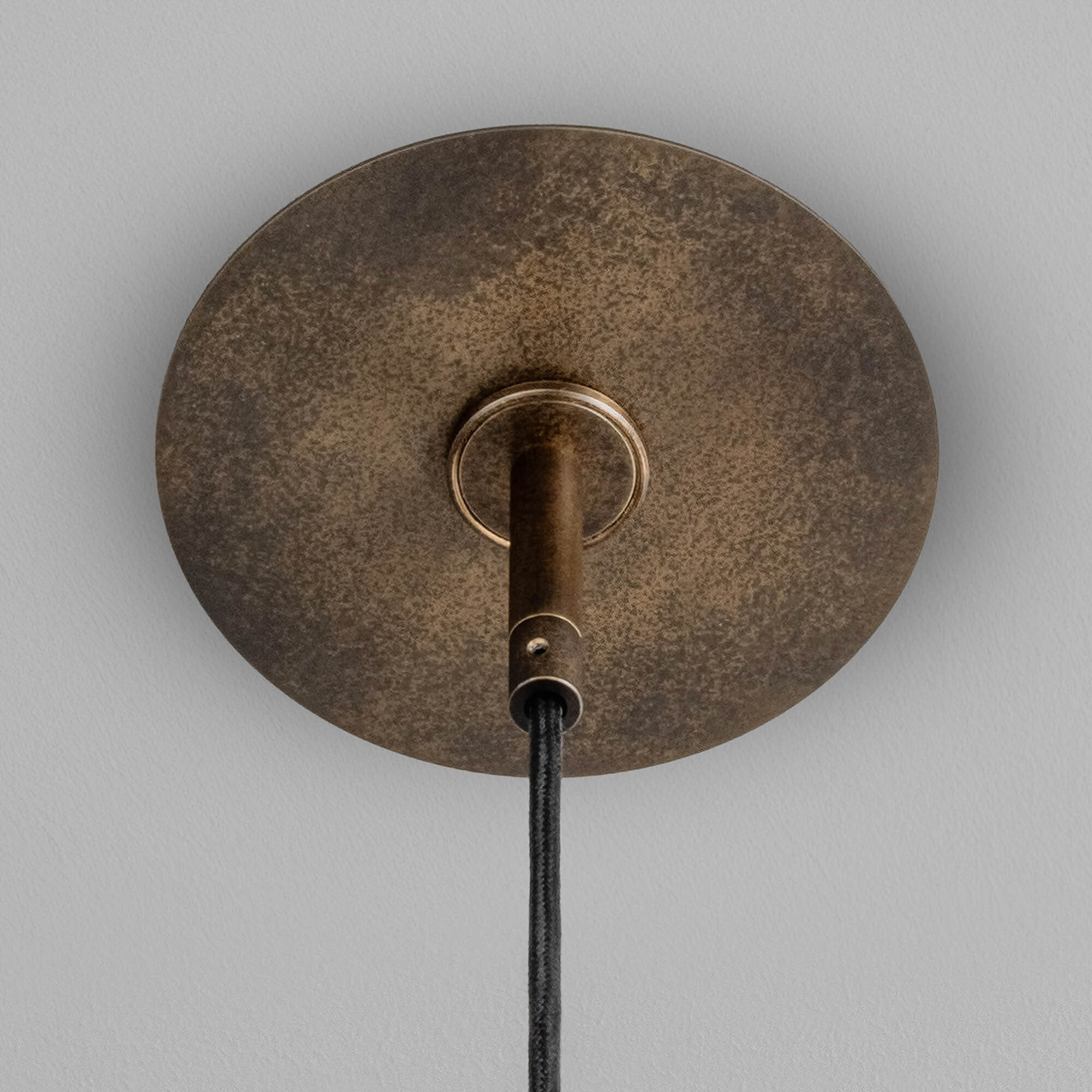 Close-up of brass canopy in Vesta single showcasing the lighting detail by Schwung.