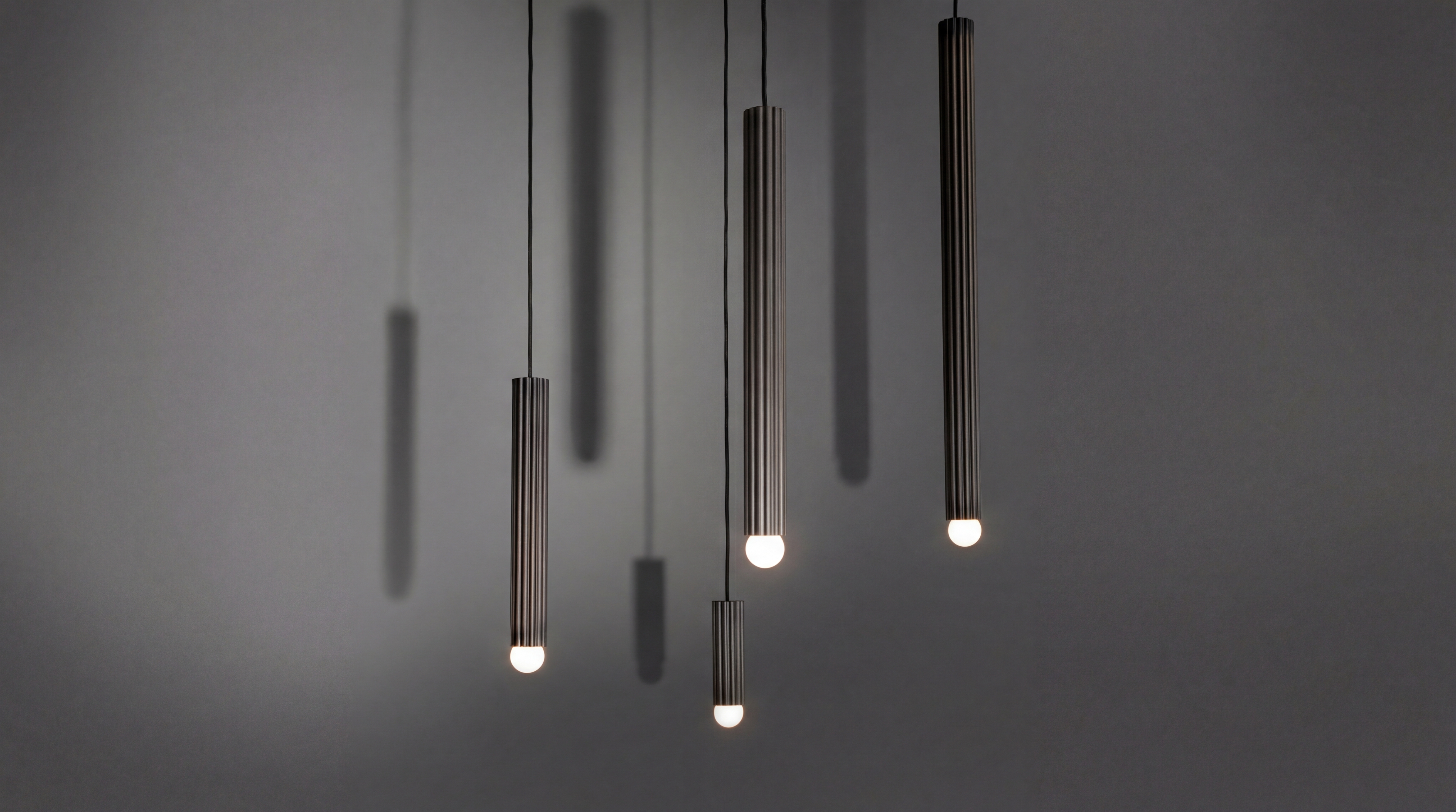 Vesta pendants in various sizes in classic bronze finish, handcrafted by Schwung.
