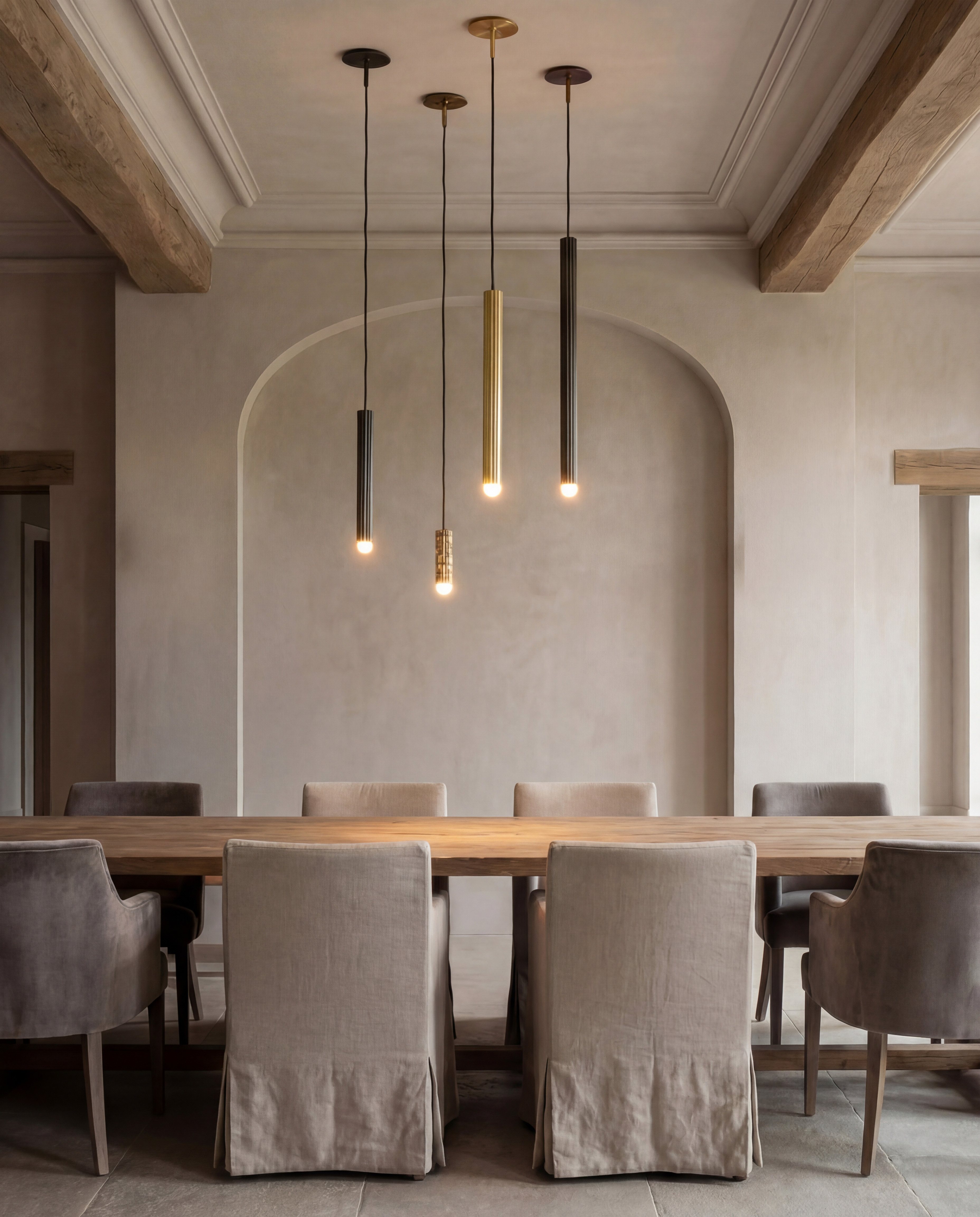 Vesta pendants in SM, MD, LG and XLG sizes, suspended above an elegant dining table in a refined neutral interior by Schwung.