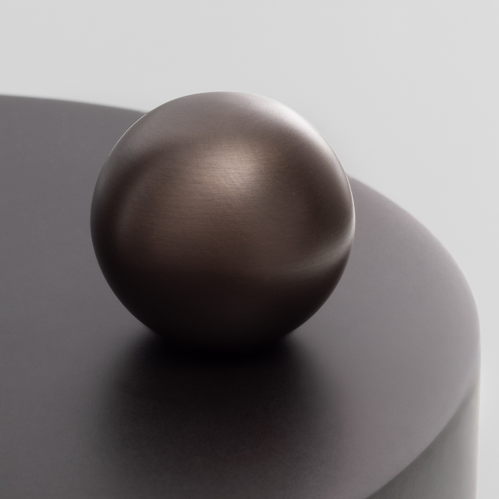 Close-up of the brass dimmer knob and switch on the Hana Table MD, showcasing the handcrafted lighting detail by Schwung.