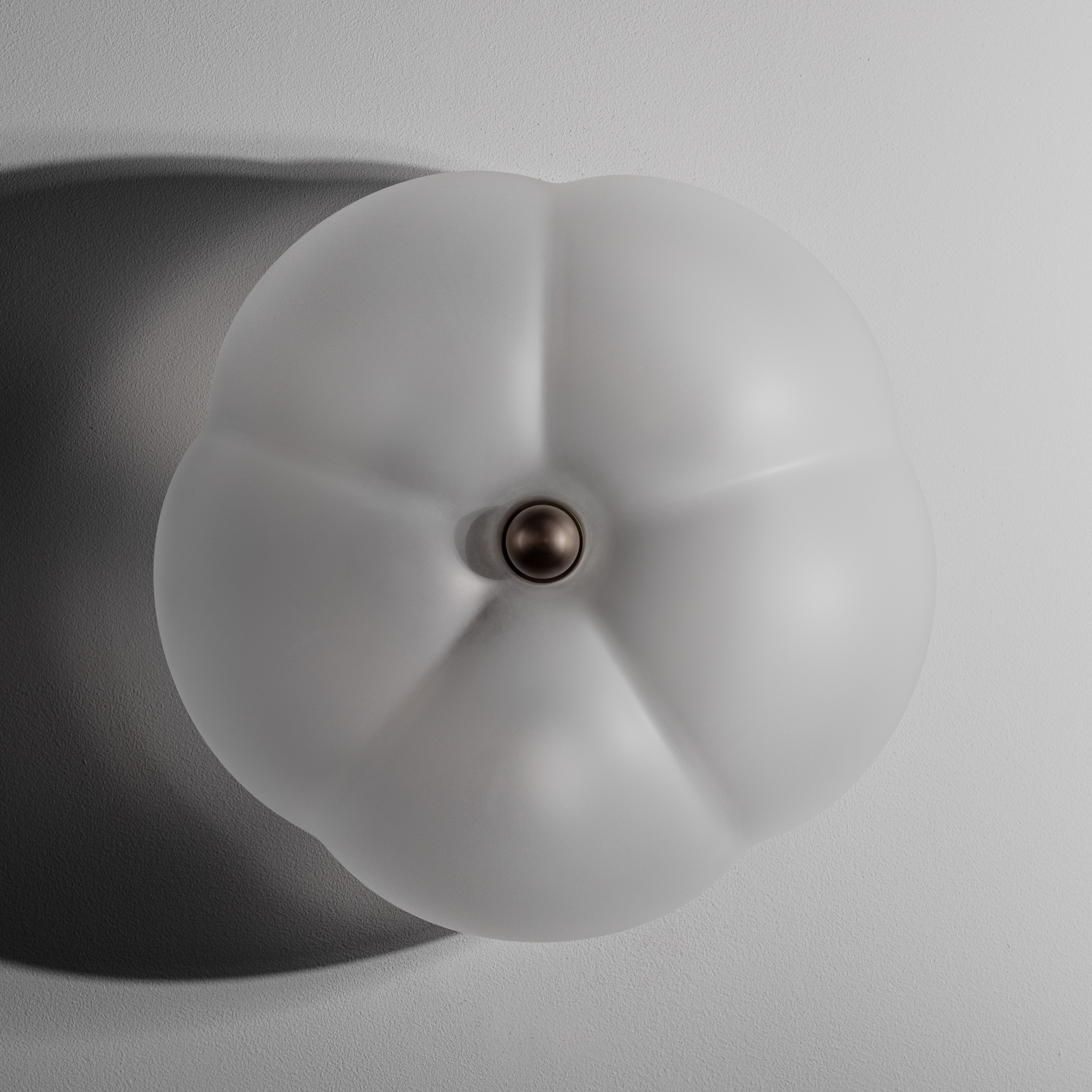 Close-up of mouth-blown glass. in Hana Table MD showcasing the handcrafted lighting detail by Schwung.