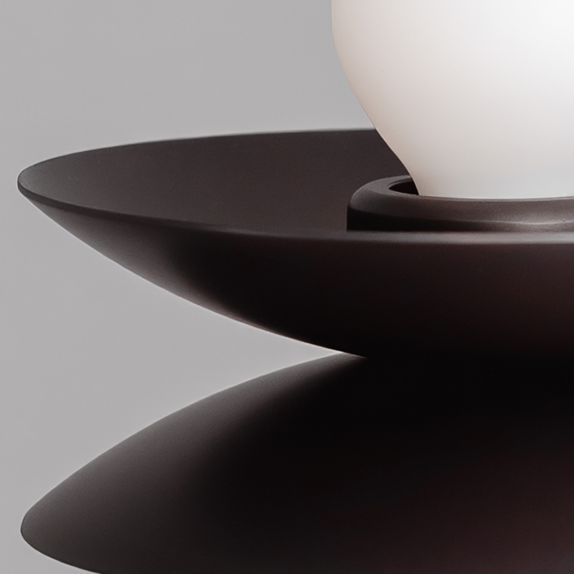 Close-up detail of the Babylon Double brass and marble wall sconce in a Classic Bronze finish, handcrafted by Schwung.