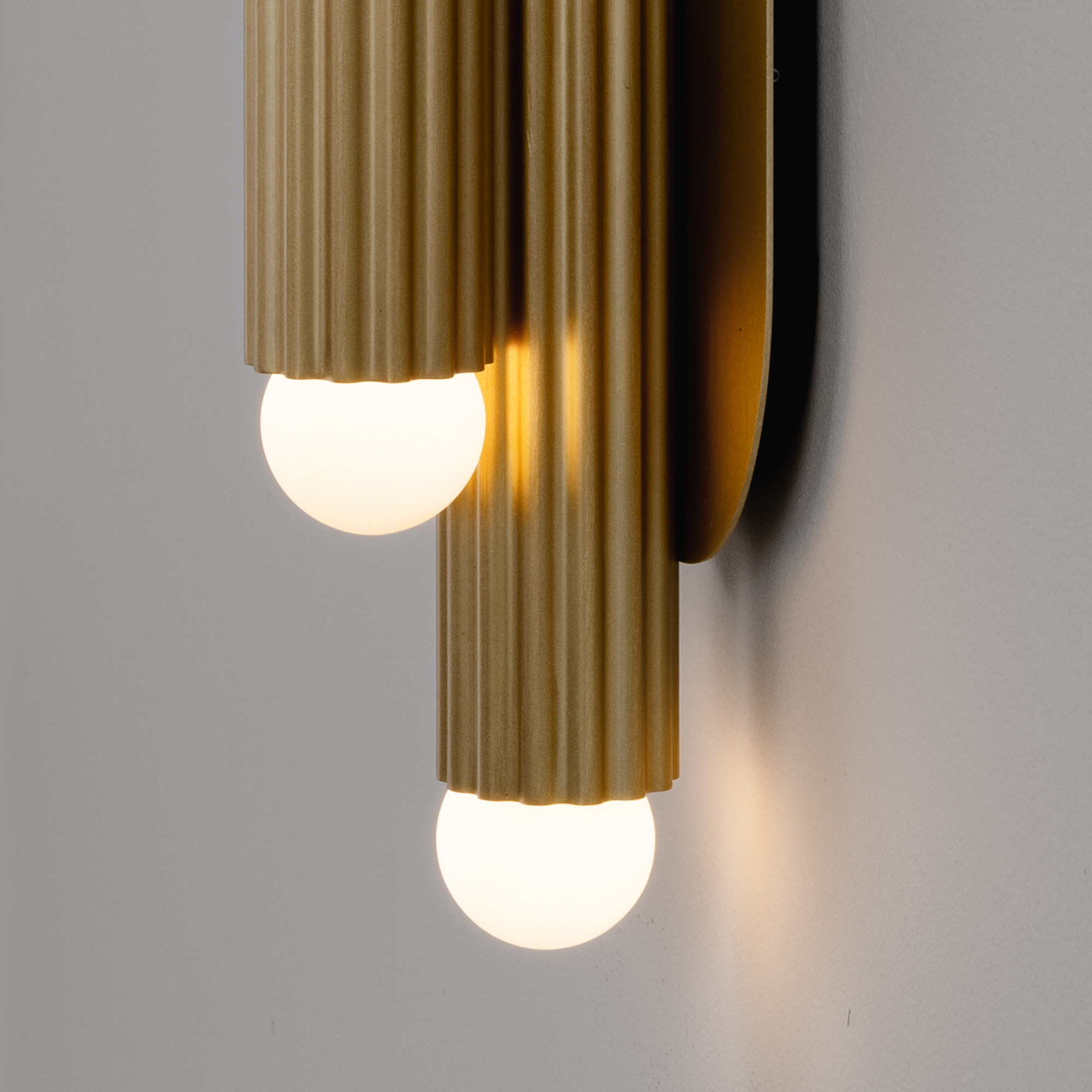 Close-up of brass elements in Vesta Legion MD Wall Sconce/Flush Mount showcasing the lighting detail by Schwung.