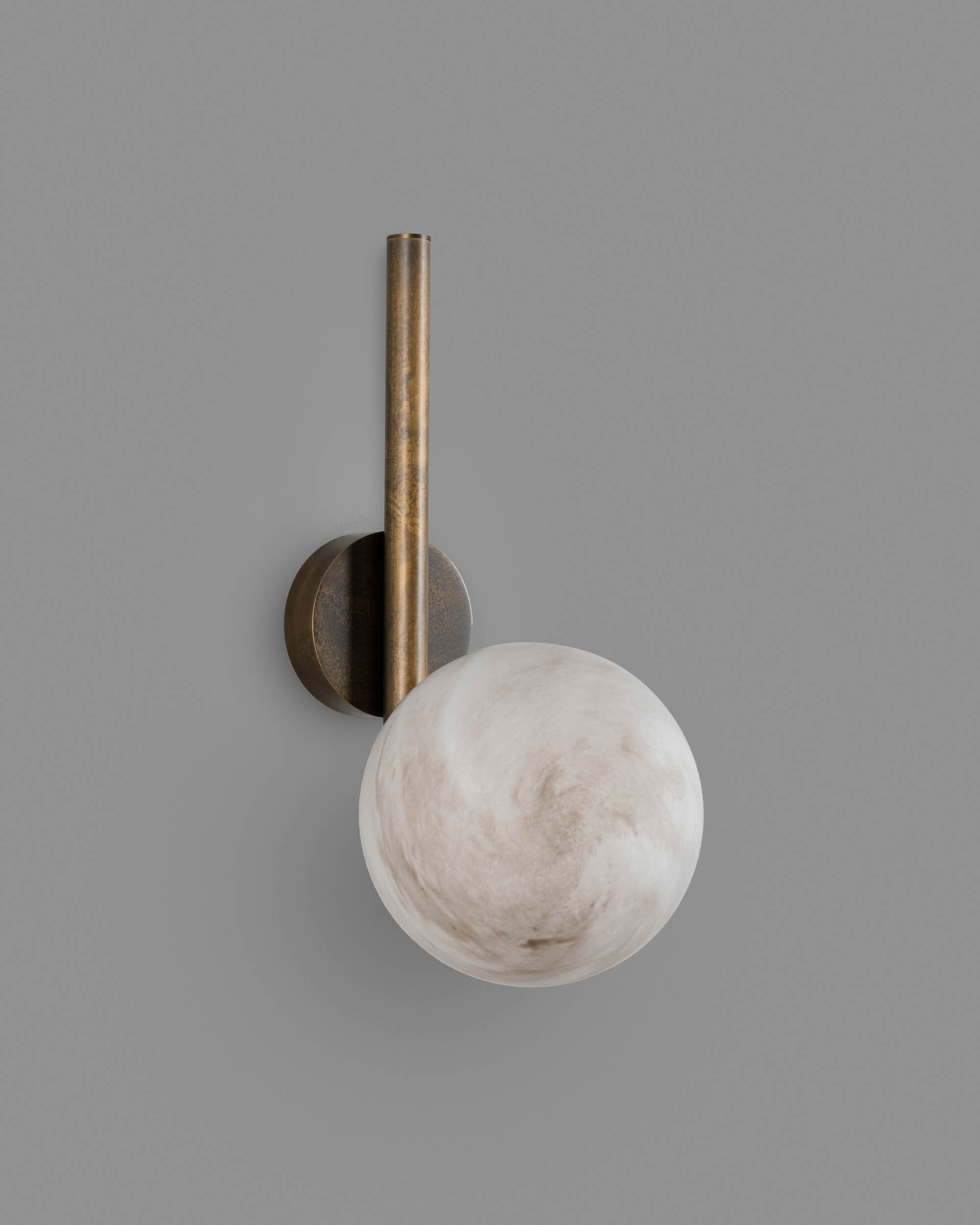 Tubular MD brass and glass wall sconce in a Classic Bronze finish with an marble glass shade, handcrafted by Schwung.