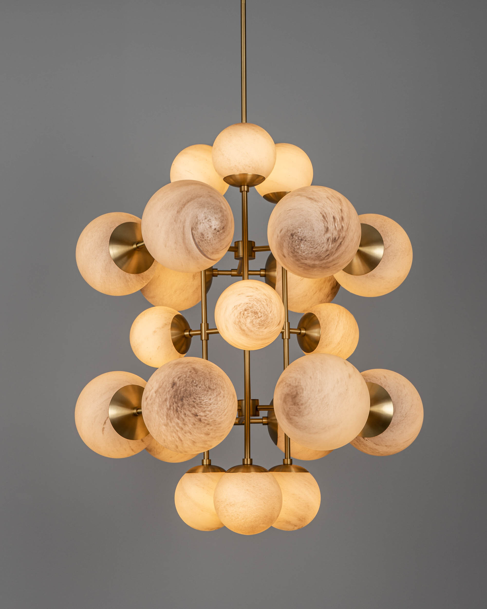 Glow brass and glass Chandelier in Lacquered Burnished Brassfinish handcrafted by Schwung