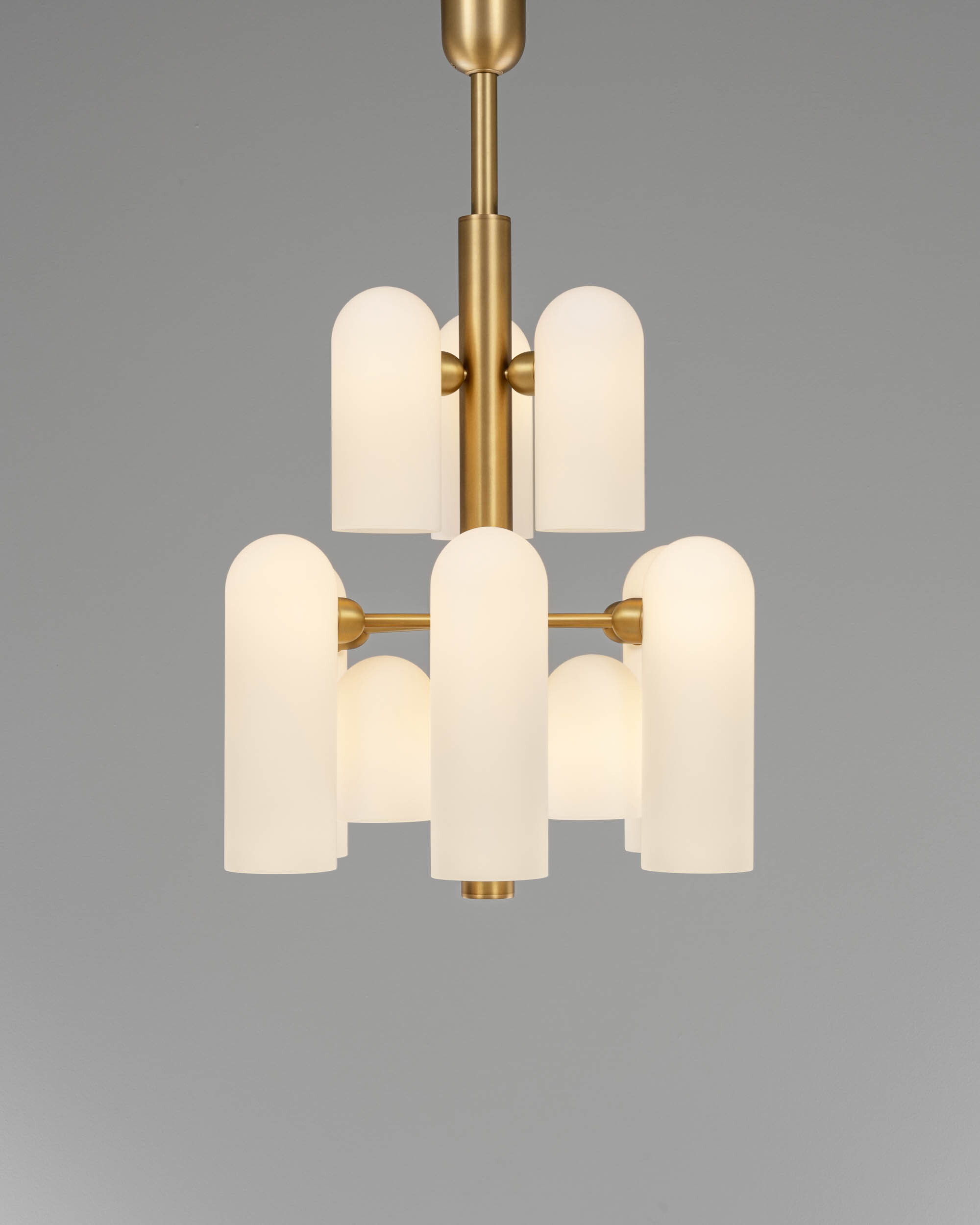 Odyssey 12 brass and glass Chandelier in lacqured burnished brass finish handcrafted by Schwung
