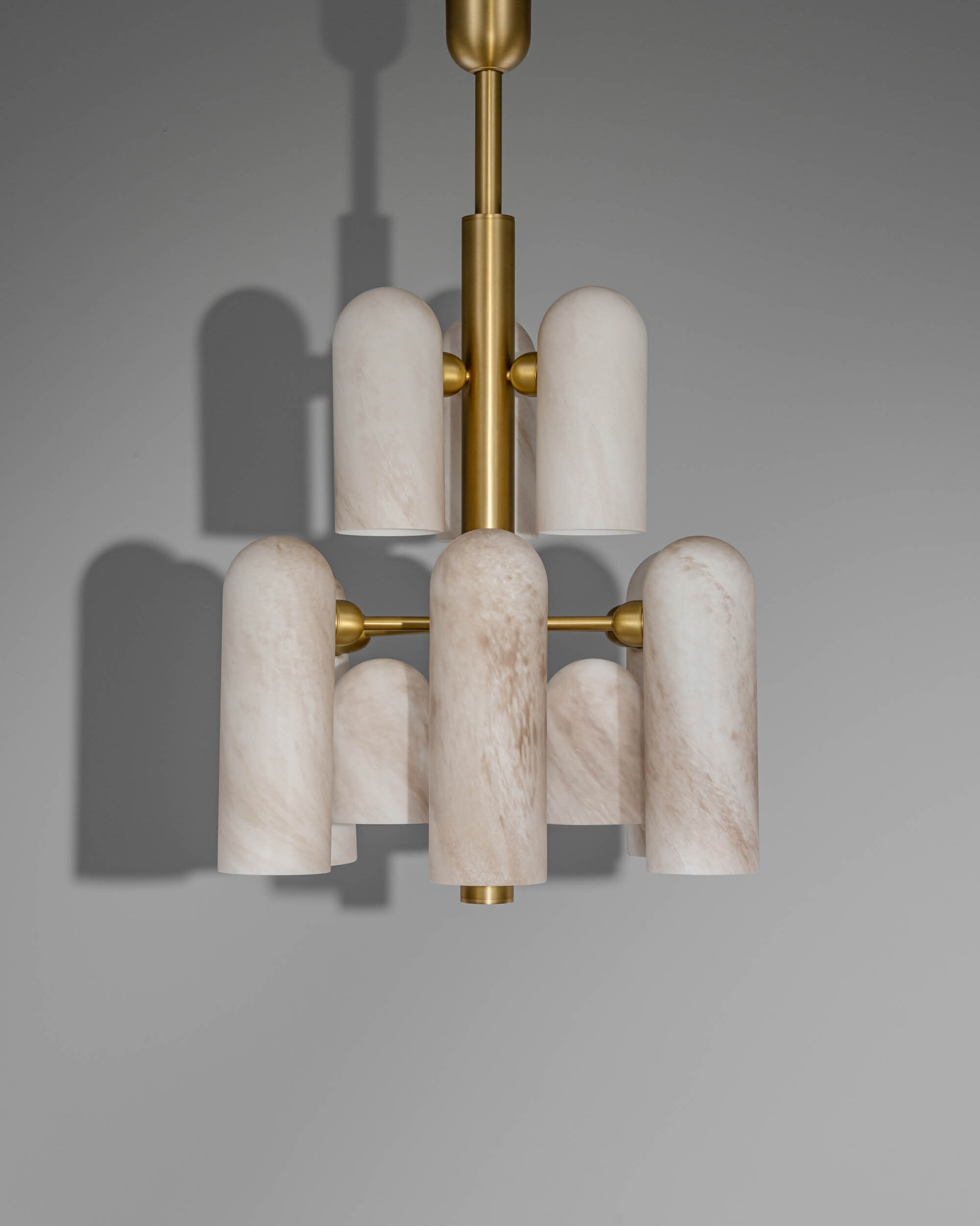 Odyssey 12 brass and glass Chandelier in lacqured burnished brass finish handcrafted by Schwung