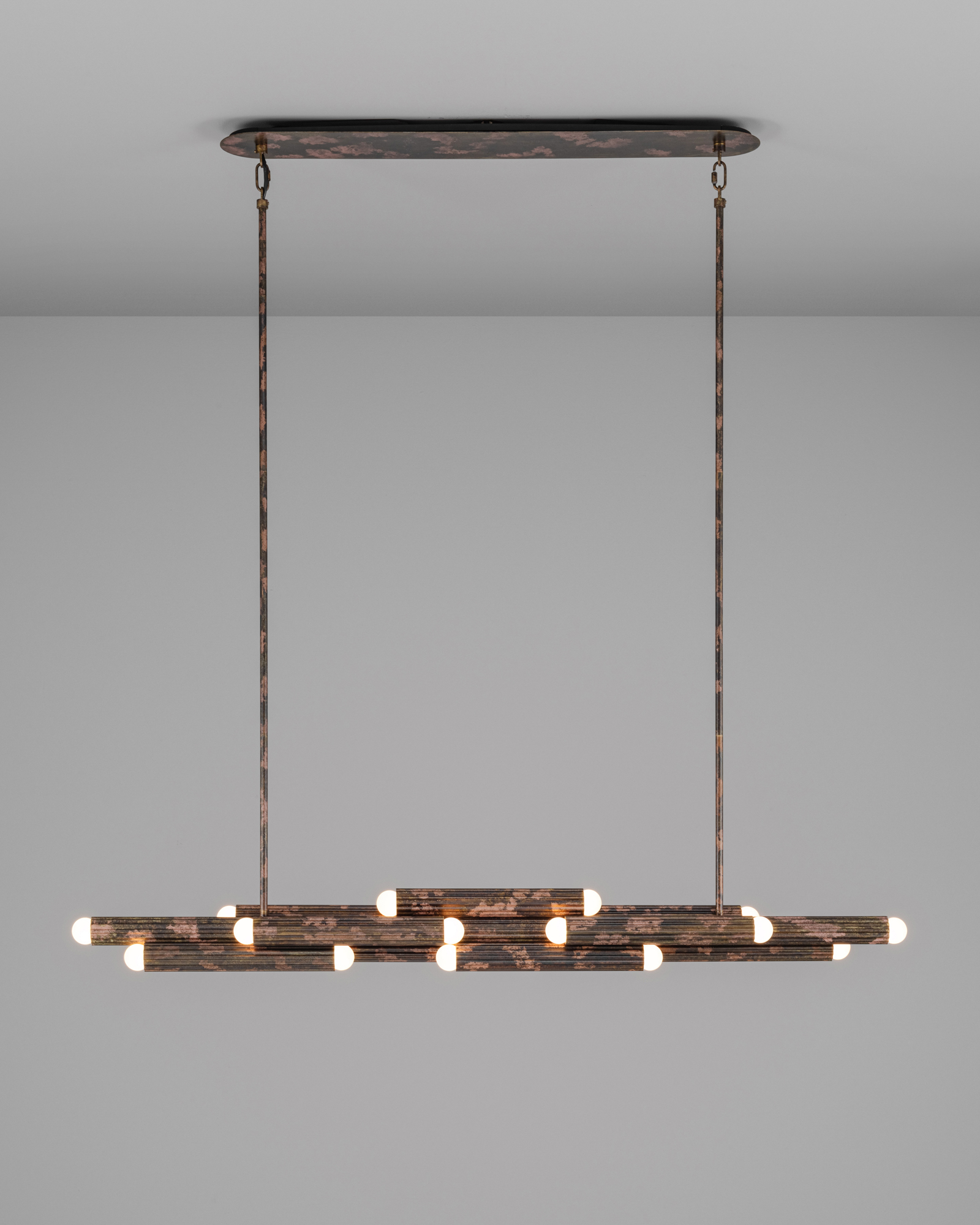 Vesta Legion Linear brass Chandelier in rose ash finish handcrafted by Schwung