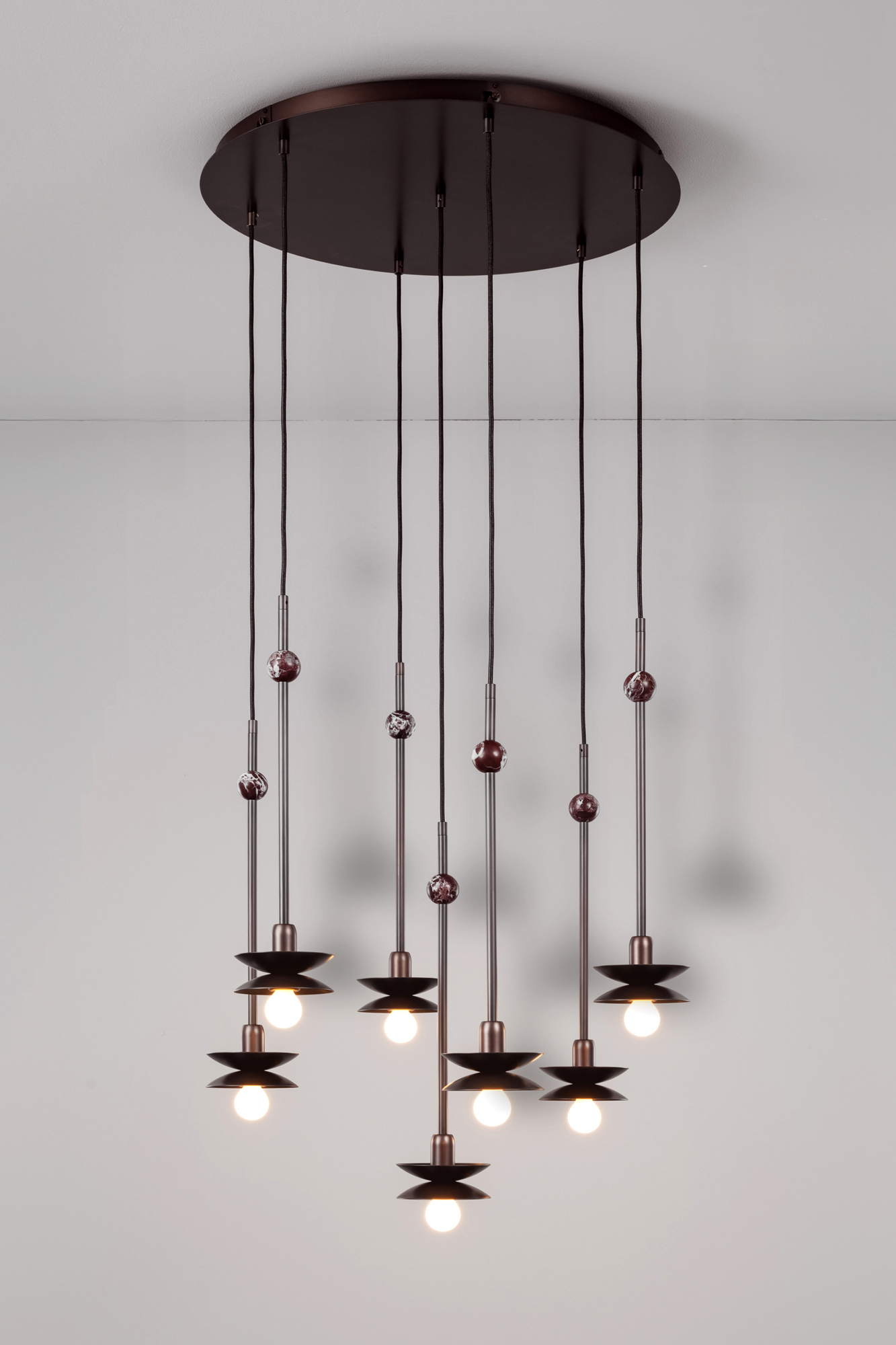 Babylon Cluster 7 brass and marble chandelier in classic bronze finish handcrafted by Schwung